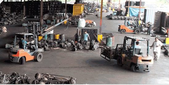 Forklifts moving parts across the 15-acre warehouse